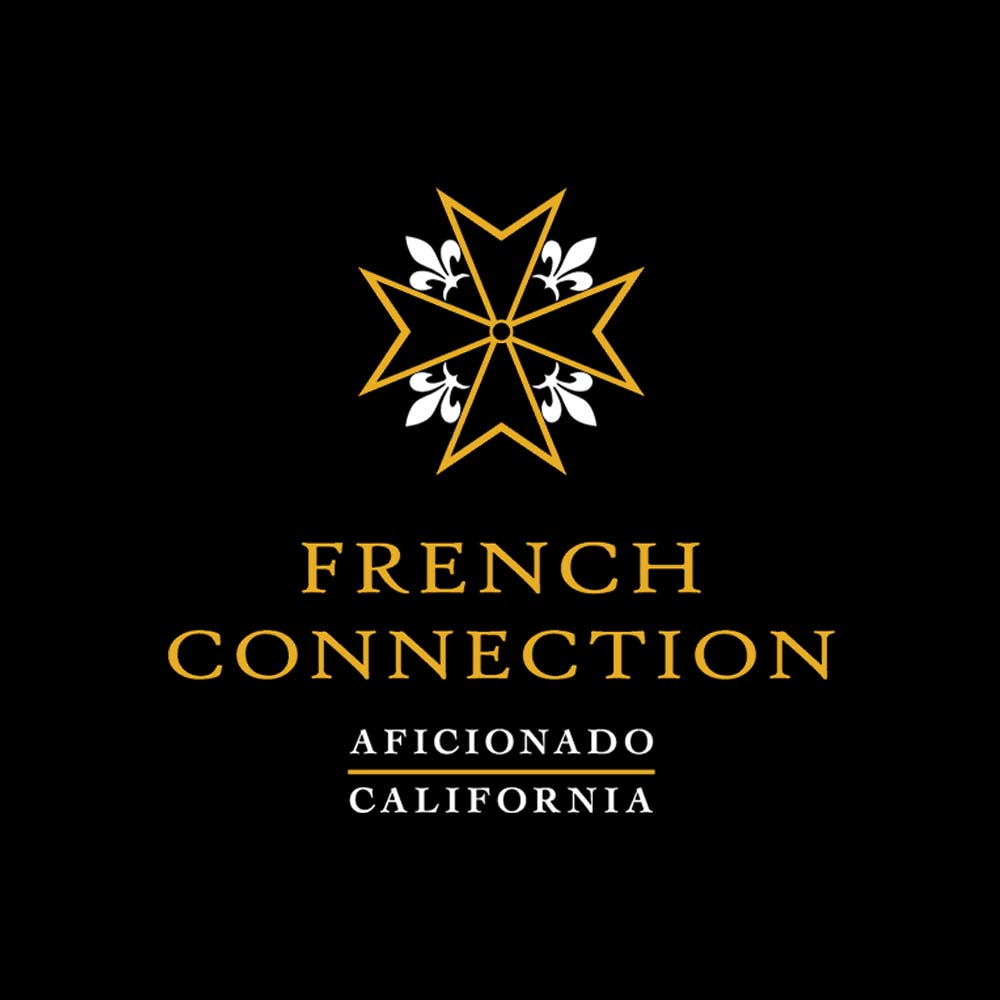 Ein goldener achtzackiger Stern über der Aufschrift FRENCH CONNECTION und ein Balken mit AFICIONADO in Gold, alles auf schwarzem Hintergrund.